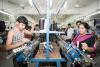 Male and female workers working in a garment factory of a South Indian country